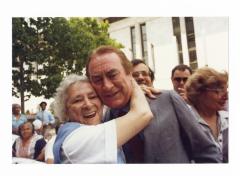 Governor Carey receives a hug from senior citizen