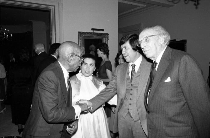 Blake and Copland conversing with members of Carey's Staff