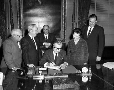 Governor Rockefeller signing a bill into law