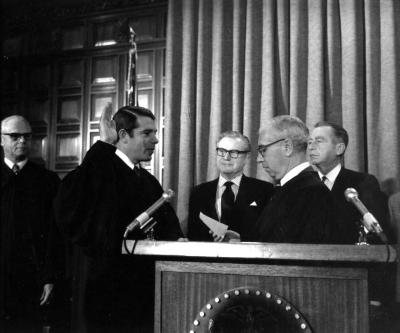 Governor Rockefeller watching as judges are sworn in