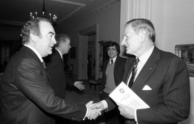 Governor Carey shakes hands with David Rockefeller