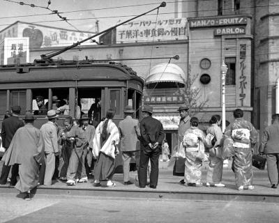 Typical Group of Men and Women, Trolley Cars on the Ginza. Tokyo, Japan