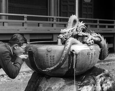 Metal Drinking Fountain Decorated with Dragons in Grounds of Ieyasu Shrine. Nikko, Japan