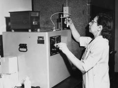 Scientist with test tube and Fiske Milk Cryoscope