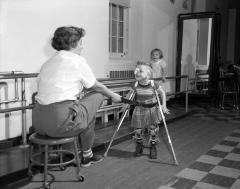 Physical therapist  with disabled children, 1954