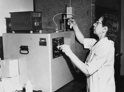 Scientist with test tube and Fiske Milk Cryoscope