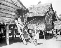 Philippine Islands.  Mindanao.  Moro Family; Huts Built on Posts