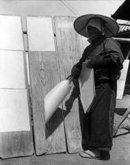 Stripping Off Mulberry Leaf Paper (Kozo) from Boards on Which it Has Dried. Japan