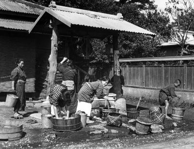 Public Wash Place, Woman Washing Clothes in Small Tubs. Kamakura, Japan