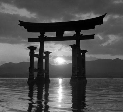 The Torii at Sunset, View from the Island to Mainland. Miyajima, Inland Sea, Japan