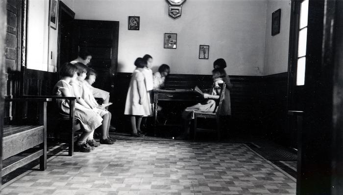 Thomas Indian School Photograph,  Young Girls Studying in a Room