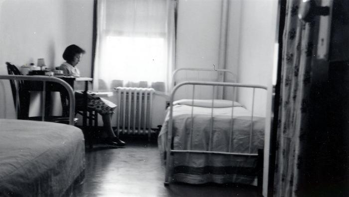 Thomas Indian School Photograph.  Girl Reading in Bedroom