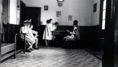 Thomas Indian School Photograph,  Young Girls Studying in a Room