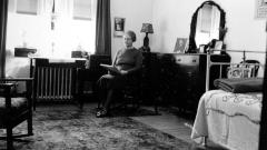 Thomas Indian School Photograph.  Woman Reading in a Bedroom