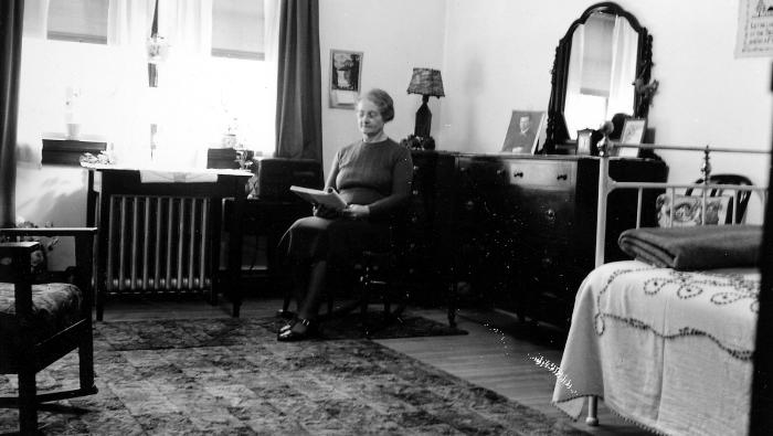 Thomas Indian School Photograph.  Woman Reading in a Bedroom