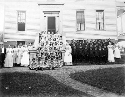 Thomas Indian School Photograph.  Class Portrait in Front of Campus Building, ca. 1890's