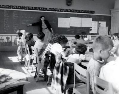 Thomas Indian School. Teacher and Students in Classroom