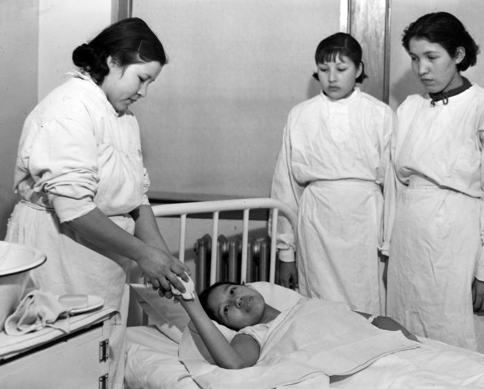 Thomas Indian School. Interior of Infirmary: Nursing Demonstration. Child In Hospital