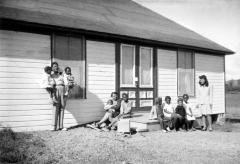 Migrant Labor Camps - Occupants In Front Of Dwelling