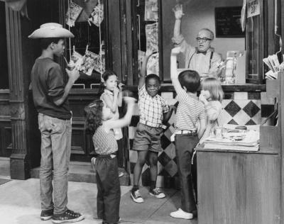 Children visiting Mr. Hooper's Store on Sesame Street