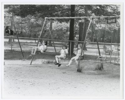 Belmont Lake State Park Playground. Kids on swings