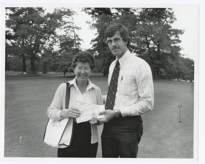 Image of man presenting check to a woman Sunken Meadow State Park Bank of New York Golf