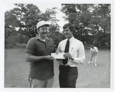 Image of man presenting check to another man. Sunken Meadow State Park Bank of New York Golf