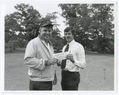 Image of man presenting check to another man. Sunken Meadow State Park Bank of New York Golf