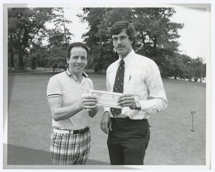Image of man presenting check to another man. Sunken Meadow State Park Bank of New York Golf