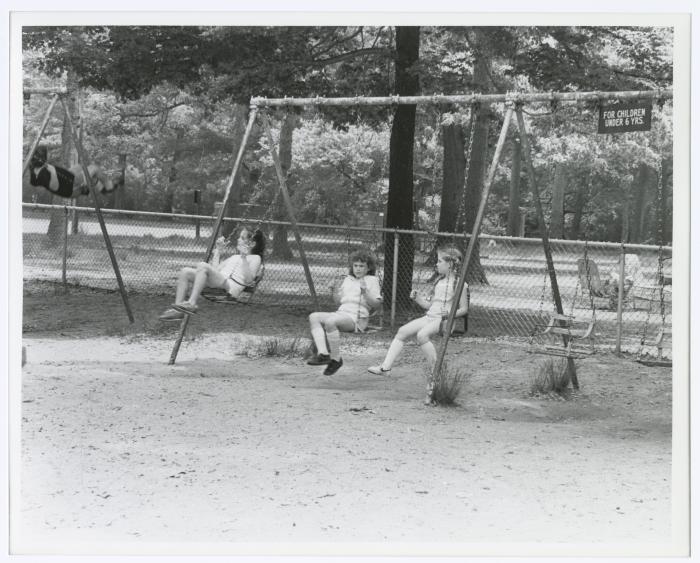 Belmont Lake State Park Playground. Kids on swings