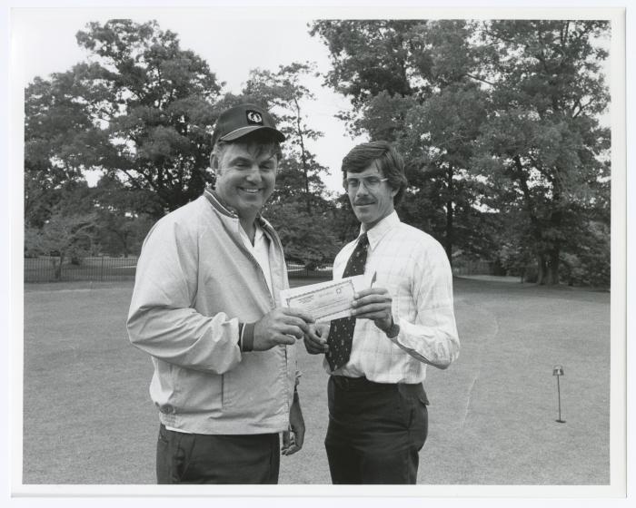 Image of man presenting check to another man. Sunken Meadow State Park Bank of New York Golf