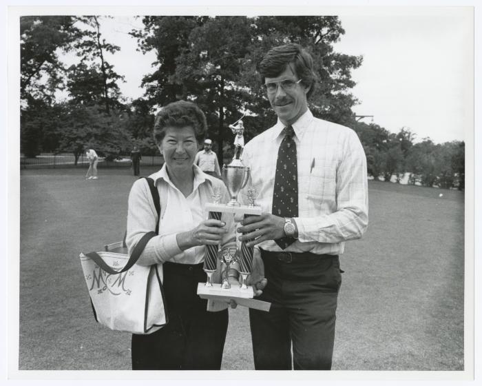 Image of man presenting a trophy to a woman Sunken Meadow State Park Bank of New York Golf