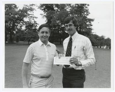Image of man presenting check to another man. Sunken Meadow State Park Bank of New York Golf