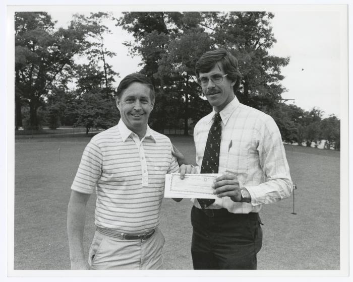 Image of man presenting check to another man. Sunken Meadow State Park Bank of New York Golf