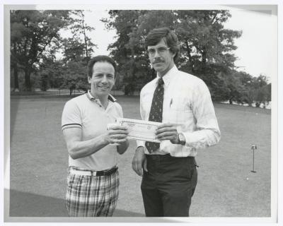 Image of man presenting check to another man. Sunken Meadow State Park Bank of New York Golf