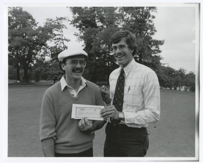 Image of man presenting check to another man. Sunken Meadow State Park Bank of New York Golf