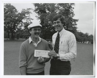 Image of man presenting check to another man. Sunken Meadow State Park Bank of New York Golf