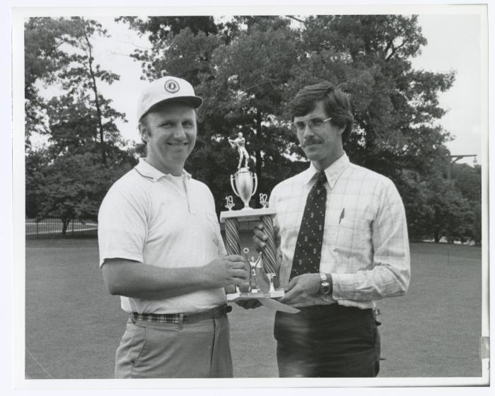 Image of man presenting check to another man. Sunken Meadow State Park Bank of New York Golf
