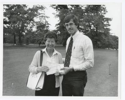 Image of man presenting check to a woman Sunken Meadow State Park Bank of New York Golf
