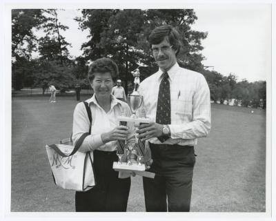 Image of man presenting a trophy to a woman Sunken Meadow State Park Bank of New York Golf