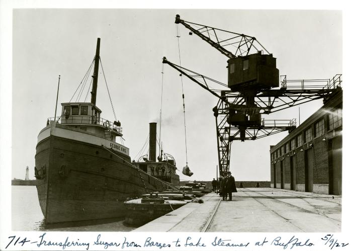 Transferring sugar from barges to lake steamer at Buffalo