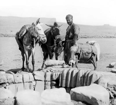 Syria.  Beersheba. An Old Well, with Grooves Worn by Ropes;  Man and Donkeys