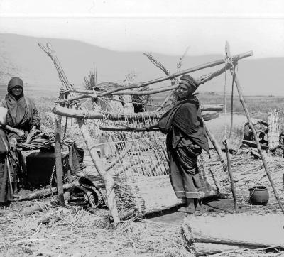 Syria.  A Bedouin Waving a Papyrus Mat