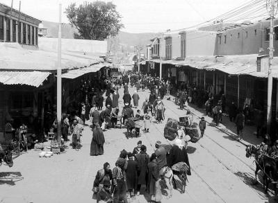 Syria.  Damascus.  Dervish Street;  Natives, Shops, Beast of Burden, Car Tracks