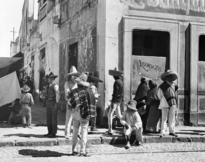 Mexico.  Pulque Shop; Natives in Sombreros and Serapes.  Mexico City.  (1912)