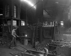 Rabbler at work at Puddling Furnace, Cohoes Rolling Mill