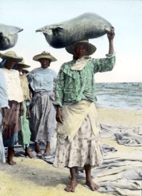 Venezuela.  Isle of Coche.  Women Carrying Bags of Salt from the Depository to the Boats