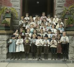 Education. School Children with Plants Raised in the Classroom