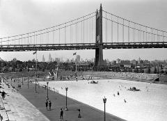 New York City. Municipal Swimming Pool With Triborough Bridge In Background.