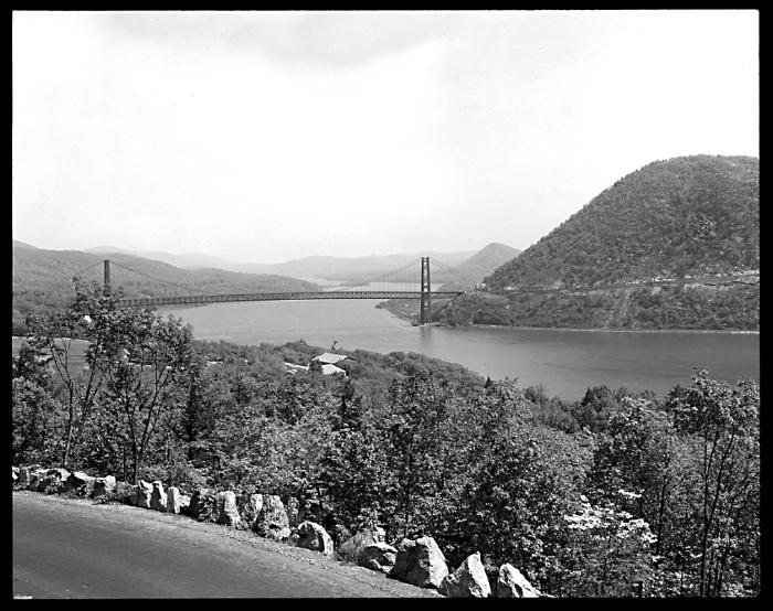 New York. Hudson River. View up from Palisades Interstate Park: Bear Mountain Bridge, Highway along Anthony's Nose, Sugar Loaf